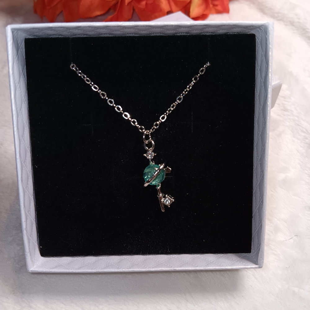 Elegant Silver and Green Planet Key Pendant Necklace